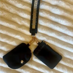lululemon athletica Black and Gold Dual Pouch Wristlet with Logo Strap NWOT